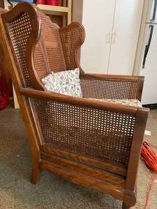 lot 71 image: Vintage Wood and Weaved Wingback Chair with Cushions