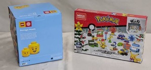 lot 45 image: LEGO Target Storage Head Large 10 And Small Boy 7 Exclusive 2 Heads AND Mega Construx Pokmon Holiday Calendar Construction Set