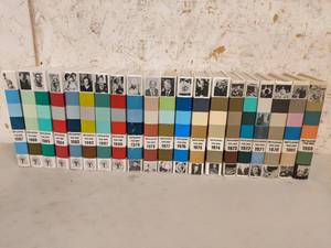 lot 01 image: 20 Volume Grolier Encyclopedia Yearbooks from 1968-1987-20 Years of History