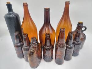 lot 117 image: 12 Vintage Amber Glass Bottles-Paul Jones Rye Whisky Bottle, Sioux City Birch Beer, And More