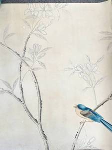 Large piece of antique wallpaper with hand painted bird painted on it