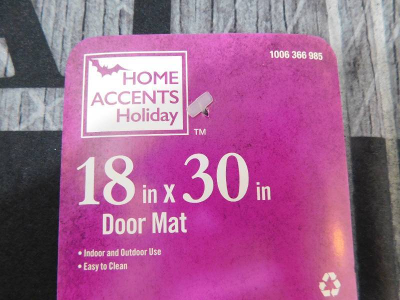 lot 109 image: Home Accents Holiday Trick or Treat Witch Feet 18 in. x 30 in. Door Mat