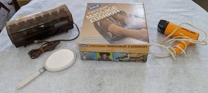 lot 36 image: Vintage Beauty Lot Mighty 1200 Compact Hair Dryer, Scholl Foot & Body Massager Cushion, Vidal Sassoon Hair Curler Kit, & Hand Mirror