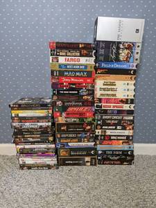 lot 119 image: Assorted DVDVHS Lot - Fargo, Mad Max, Pirates of the Caribbean, Indiana Jones, and more