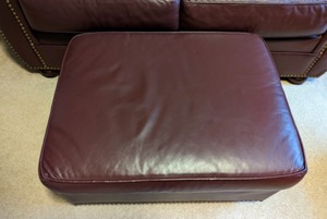 lot 55 image: Burgundy Leathercraft Sofa and Ottoman