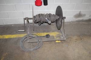 lot 215 image: 220V Heavy Duty Extension Cord with Reel