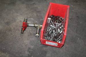 lot 577 image: Lot of  Hardware - 1-12 to 3 Nuts and Bolts, Relief Valve