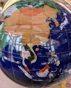 lot 11 image: Gorgeous Inlaid Stone Rotating Globe with Stand