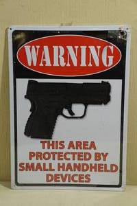 NEW Tin Warning Sign Protected By Small Handheld Devices