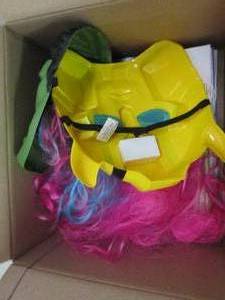 box of halloween masks, wig, and ba...
