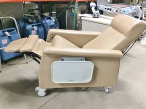 lot 5 image: WOW MSRP $3000 Winco Carecliner Mobile Extra Wide Reclining Mobile Geri Chair With Heat & Massage - Excellent Working Condition Has Trays On Both Sides With Cup Holder Inserts