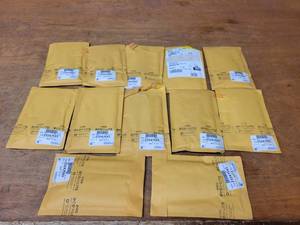 lot 875 image: NOS - Lot of 12 Genuine GM Belt Kits - Part No. 23247593