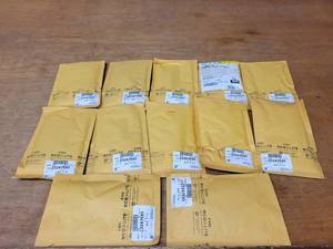 lot 876 image: NOS - Lot of 12 Genuine GM Belt Kits - Part No. 23247593