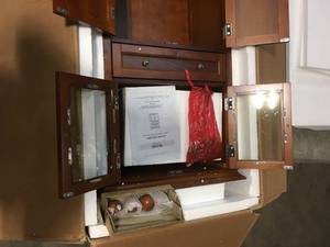 lot 16 image: Hampton Harbor 25 in. W 4-Door Tall Cabinet in Sequoia by Home Decorators Collection Customer Returns See Pictures