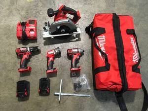 lot 20 image: M18 18-Volt Lithium-Ion Cordless Combo Tool Kit (4-Tool) with Two Batteries, Charger, Tool Bag by Milwaukee Customer Returns See Pictures