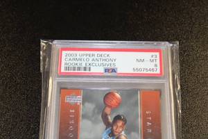 lot 19 image: 2003-04 Upper Deck Rookie Exclusives Carmelo Anthony #3 PSA 8 Rookie Card
