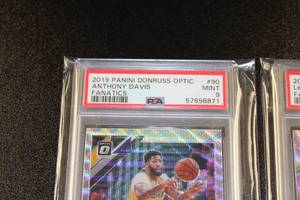 lot 21 image: 2019-20 Donruss Optic Fanatics Prizm LeBron James & Anthony Davis PSA 9  Lot of 2