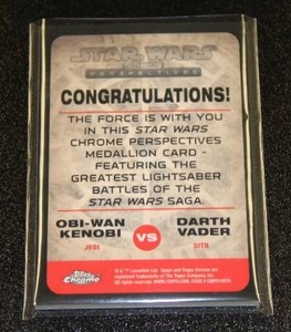 lot 72 image: Topps Chrome Star Wars Bronze Medallion Relic Obi Wan Kenobi & Darth Vader