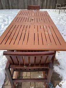 lot 230 image: Teak Outdoor Table and Two Chairs by Kingsley and Bates