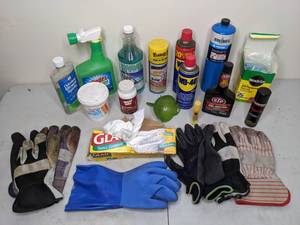 lot 140 image: Cleaning and Chemical Lot - WD-40, Garbage Bags, Gloves, Miracle-Gro, Rust Dissolver, STP Fuel Injector Cleaner, Windex Outdoor, and more