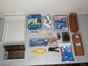 lot 145 image: Miscellaneous Around The House Lot - Drawer Storage, Rechargeable Bark Control Collar, Reynolds Grill Buddies, Water Pipe Heat Cable, Outlet Adapter, and more