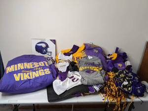 lot 202 image: Huge Collection of Minnesota Vikings Football Items Jerseys, Sweatshirts, Book, Light Switch Covers, Koozies and More
