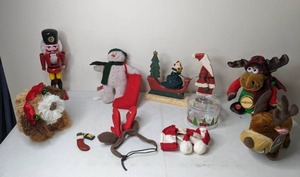 lot 212 image: Indoor Christmas Decor Lot Nutcracker, Santa Pulling Sleigh, Singing Moose and More