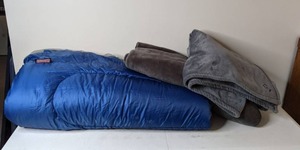 lot 259 image: Coleman Blue Sleeping bag with throws