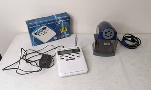 lot 283 image: Midland Weather Radio and Pencil Sharpener