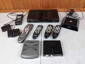 lot 350 image: Lot of 4 Cable Boxes and Remotes Xfinity, Comcast, and TiVo Mini