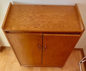 lot 74 image: Wood Two Door Storage Cabinet on Casters