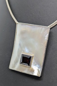 lot 291 image: Mother of Pearl Pendant and Sterling Silver Necklace