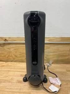 lot 101 image: DELONGHI 1500-Watt Oil-filled Radiant Compact Personal Indoor Electric Space Heater with Thermostat