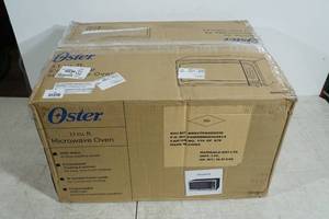 lot 61 image: NEW Oster 1.1 Cu Ft Stainless Microwave Oven