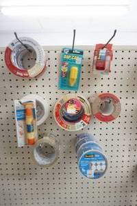 Tape, adhesive and caulk tool