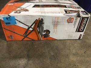 9 Amp Corded 7 in. Wet Tile Saw with Stand by RIDGID Customer Returns See Pictures