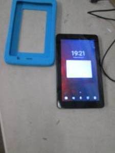 kurio tablet with charger powers on...