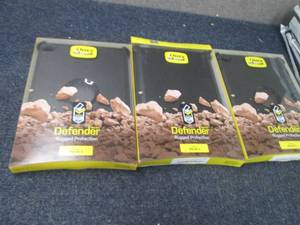 lot 221 image: 4 Otter Defender Cases for iPad Air...