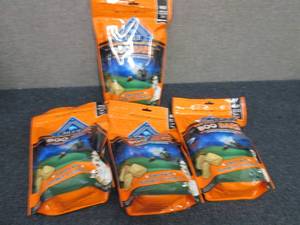 lot 79 image: 4- 11 oz bags Blue Buffalo Boo Bars...