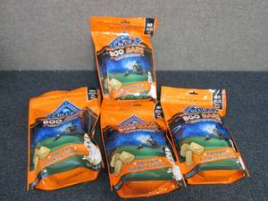 lot 83 image: 4- 11 oz bags Blue Buffalo Boo Bars...