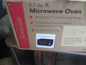 lot 123 image: Sunbeam 0.7 Cu. Ft. 700-Watt Counte...
