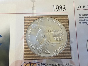 lot 28 image: 1983-P Olympic Silver Dollar In Dis...