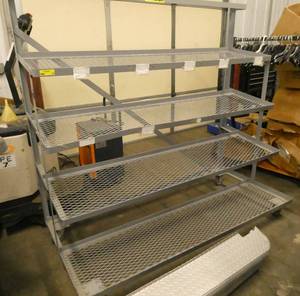 Tiered shelving cart on wheels, 68 wide, each shelf is 17 deep, 64 tall