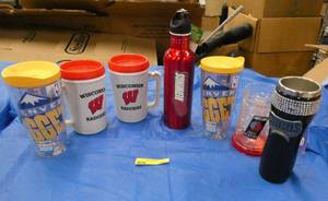 Group of hot cold mugs from various teams