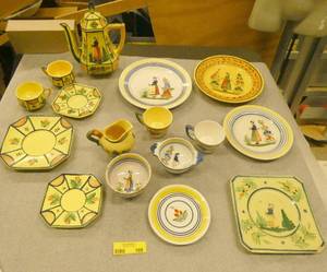 Lot of Henriot Quimper plates and cups of various age and quality.