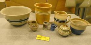 Group of pottery items, some have cracks and pitting
