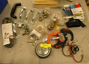 Misc lot of commercial supplies, door handles, door stops, electrical cord, etc