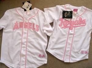 Two girls baseball jerseys 810 and 1214