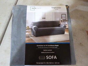 lot 34 image: Mainstays Sofa Slip Cover