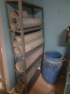 Metal shelf filled with duct sections